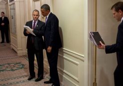 Barack Obama, center, talks with advisor Ben Rhodes, to his right, at the White House. (Photo: Reuters)