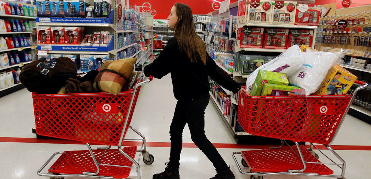 A woman pulls shopping carts through the aisle of a Target store in Torrington, Connecticut November 25, 2011. (Photo: Reuters)