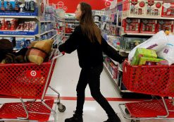 A woman pulls shopping carts through the aisle of a Target store in Torrington, Connecticut November 25, 2011. (Photo: Reuters)