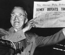 Incumbent President Harry Truman holds up a Chicago Tribune headline stating that he had been defeated by Thomas E. Dewey, the Republican candidate in the 1948 presidential election.