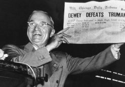 Incumbent President Harry Truman holds up a Chicago Tribune headline stating that he had been defeated by Thomas E. Dewey, the Republican candidate in the 1948 presidential election.