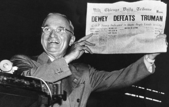 Incumbent President Harry Truman holds up a Chicago Tribune headline stating that he had been defeated by Thomas E. Dewey, the Republican candidate in the 1948 presidential election.