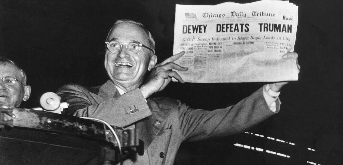 Incumbent President Harry Truman holds up a Chicago Tribune headline stating that he had been defeated by Thomas E. Dewey, the Republican candidate in the 1948 presidential election.