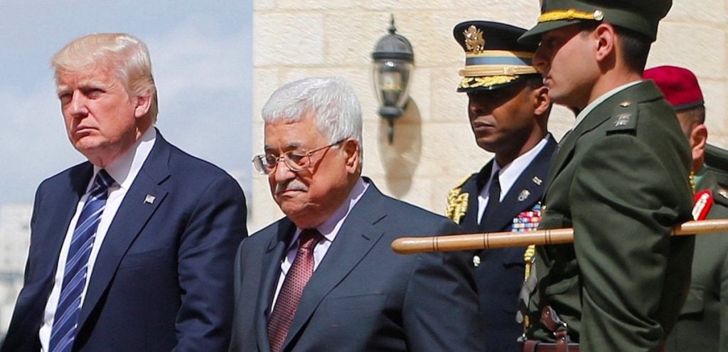 U.S. President Donald Trump and Palestinian President Mahmoud Abbas review the honor guard during a reception ceremony at the presidential headquarters in the West Bank town of Bethlehem, May 23, 2017. (Photo: Reuters)