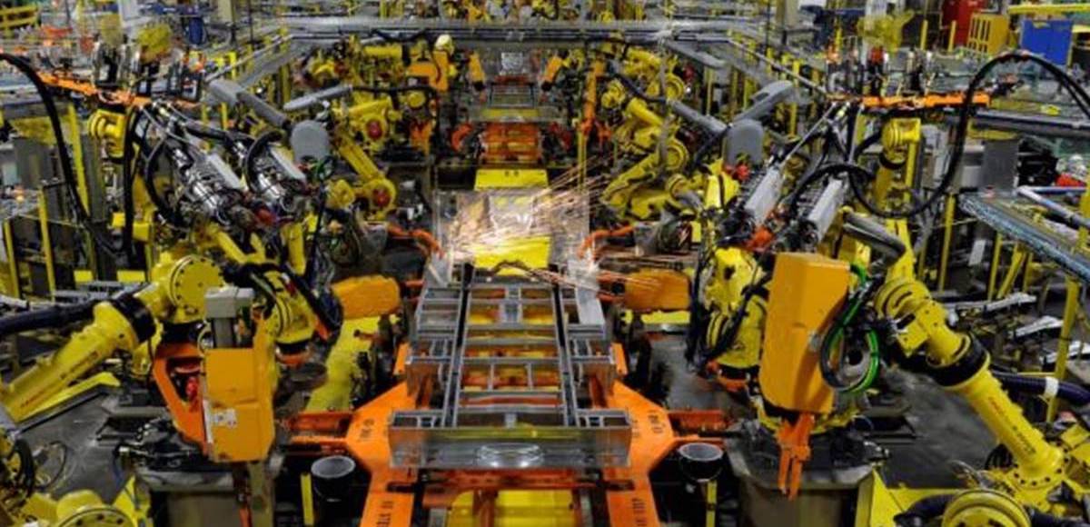 Robotic arms spot welds on the chassis of a Ford Transit Van under assembly at the Ford Claycomo Assembly Plant in Claycomo, Missouri April 30, 2014. (Photo: Reuters)