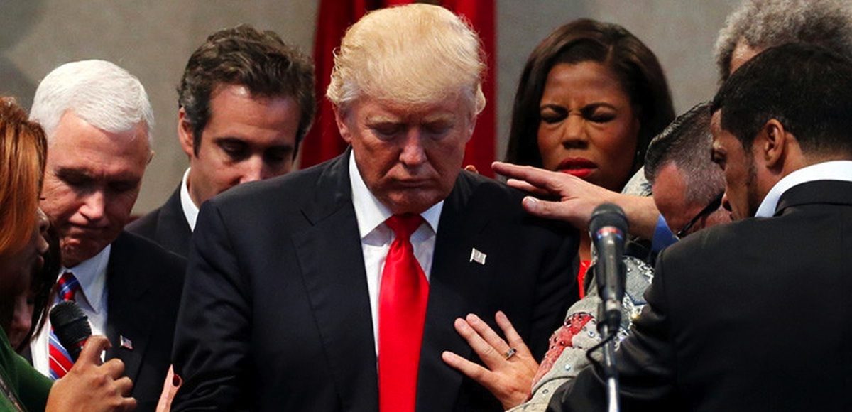 Members of the clergy lay hands and pray over then-Republican presidential nominee Donald J. Trump at the New Spirit Revival Center in Cleveland Heights, Ohio. (Photo: Reuters)