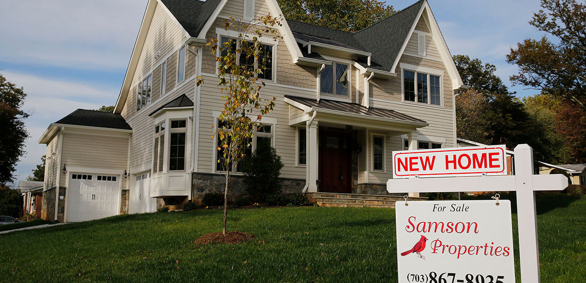 A real estate sign advertising a new home for sale is pictured in Vienna, Virginia, outside of Washington, October 20, 2014. (Photo: Reuters)