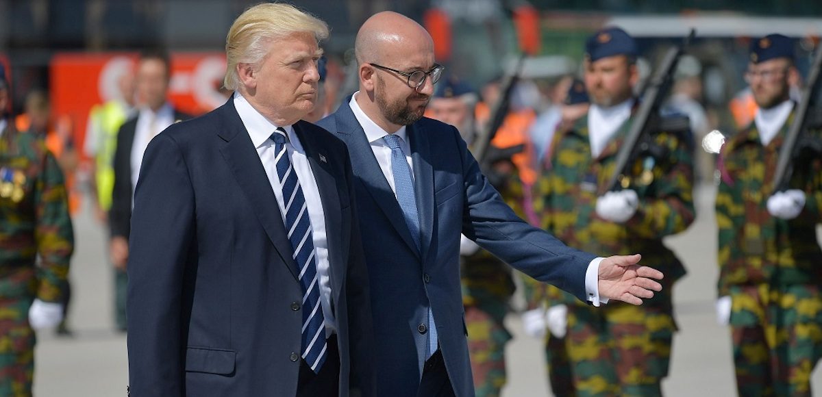 President Donald J. Trump (L) walks next to Belgian Prime Minister Charles Michel (R) upon arrival at the Melsbroek military airport in Steenokkerzeel on May 24, 2017, the eve of the NATO summit. (Photo: Reuters)
