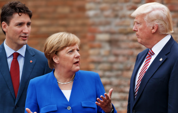 German Chancellor Angela Merkel, center, talks with Canadian Prime Minister Justin Trudeau, left, and President Donald Trump during a family photo with G7 leaders at the Ancient Greek Theater of Taormina during the G7 Summit, Friday, May 26, 2017, in Taormina, Italy. (Photo: AP)