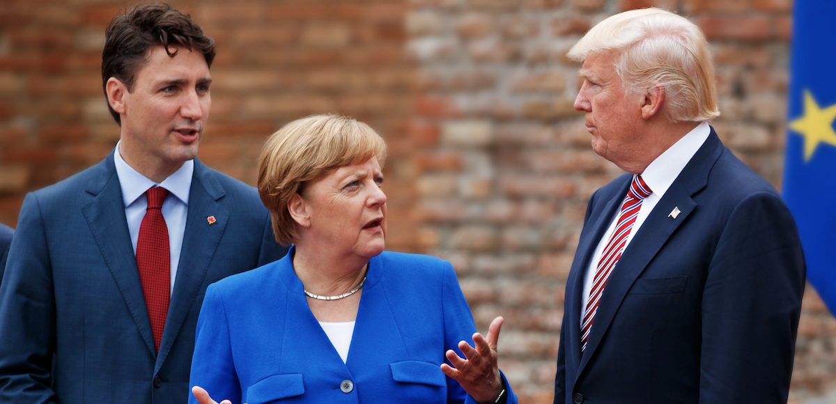 German Chancellor Angela Merkel, center, talks with Canadian Prime Minister Justin Trudeau, left, and President Donald Trump during a family photo with G7 leaders at the Ancient Greek Theater of Taormina during the G7 Summit, Friday, May 26, 2017, in Taormina, Italy. (Photo: AP)