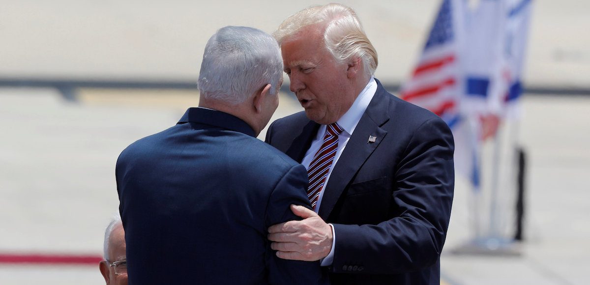 U.S. President Donald Trump (R) hugs Israeli Prime Minister Benjamin Netanyahu upon his arrival at Ben Gurion International Airport in Lod near Tel Aviv, Israel May 22, 2017. (Photo: Reuters)