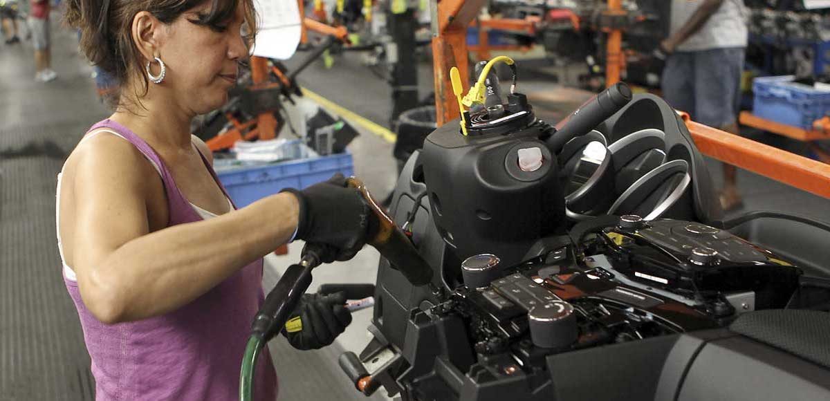 A worker installs parts onto the dashboard for the new Chevrolet Cruze car as it moves along the assembly line at the General Motors Cruze assembly plant in Lordstown, Ohio July 22, 2011. (Photo: Reuters)