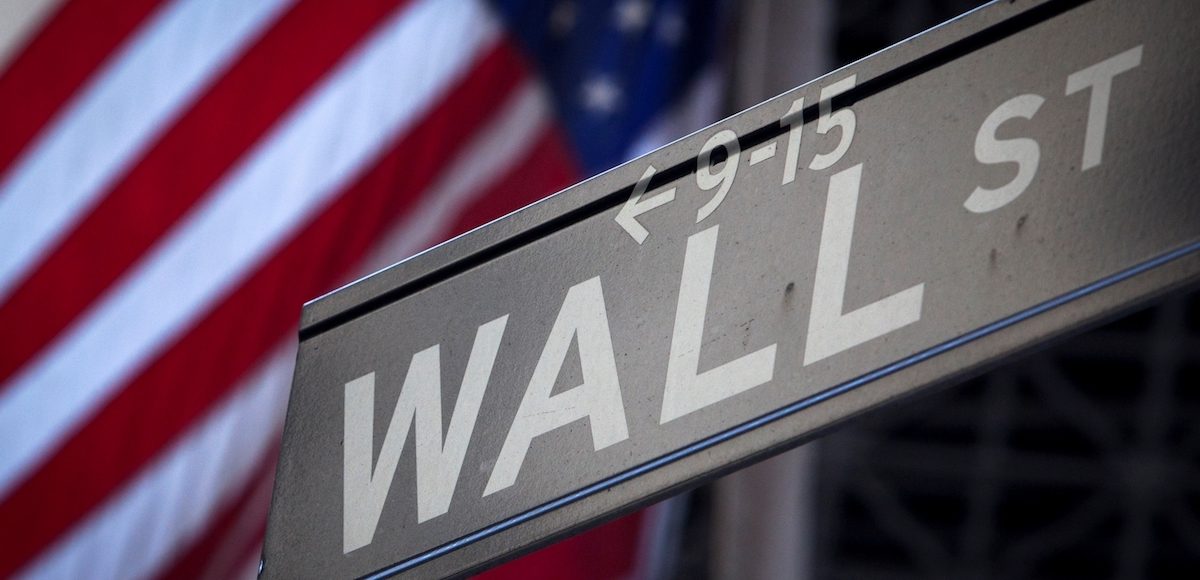 A Wall Street sign is pictured outside the New York Stock Exchange in New York, October 28, 2013. (Photo: Reuters)