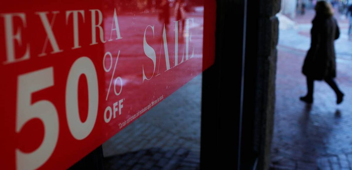 A shopper passes a ''Sale'' sign at Quincy Market in downtown in Boston, Massachusetts, U.S. January 11, 2017. (Photo: Reuters)