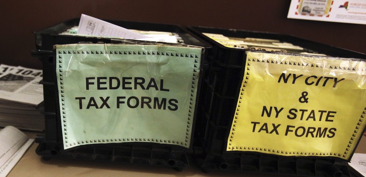 FILE PHOTO - Crates filled with 2011 tax forms are seen at the 96th Street Public Library in New York April 17, 2012. (Photo: Reuters)