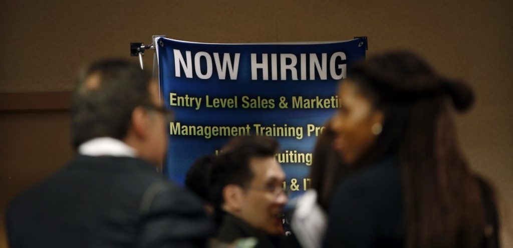 Job seekers wait to meet with employers at a career fair in New York City, October 24, 2012. (Photo: Reuters)