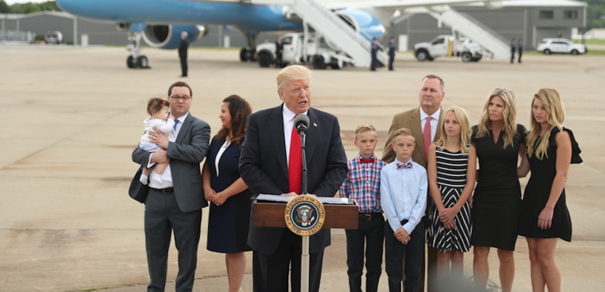 President Donald J. Trump speaks about healthcare at Cincinnati Municipal Lunken Airport in Cincinnati, Ohio, Wednesday, June 7, 2017. Shown are PlayCare co-owner Rays Whalen, left, and CSS Distribution Group President Dan Withrow and their families. (Photo: AP)