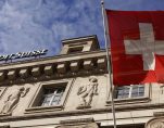 A national flag of Switzerland flies in front of a branch office of Swiss bank Credit Suisse in Luzern October 30, 2014. (Photo: Reuters)