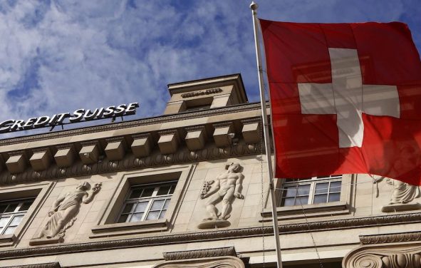 A national flag of Switzerland flies in front of a branch office of Swiss bank Credit Suisse in Luzern October 30, 2014. (Photo: Reuters)