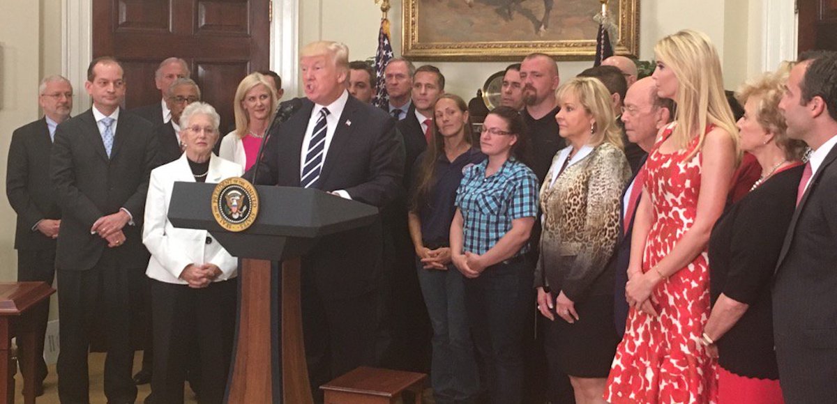 President Donald J. Trump, center a podium, announces an executive order to expand apprenticeships in an effort to close the skills gap in America. (Photo: White House Press Secretary Sean Spicer via Twitter)