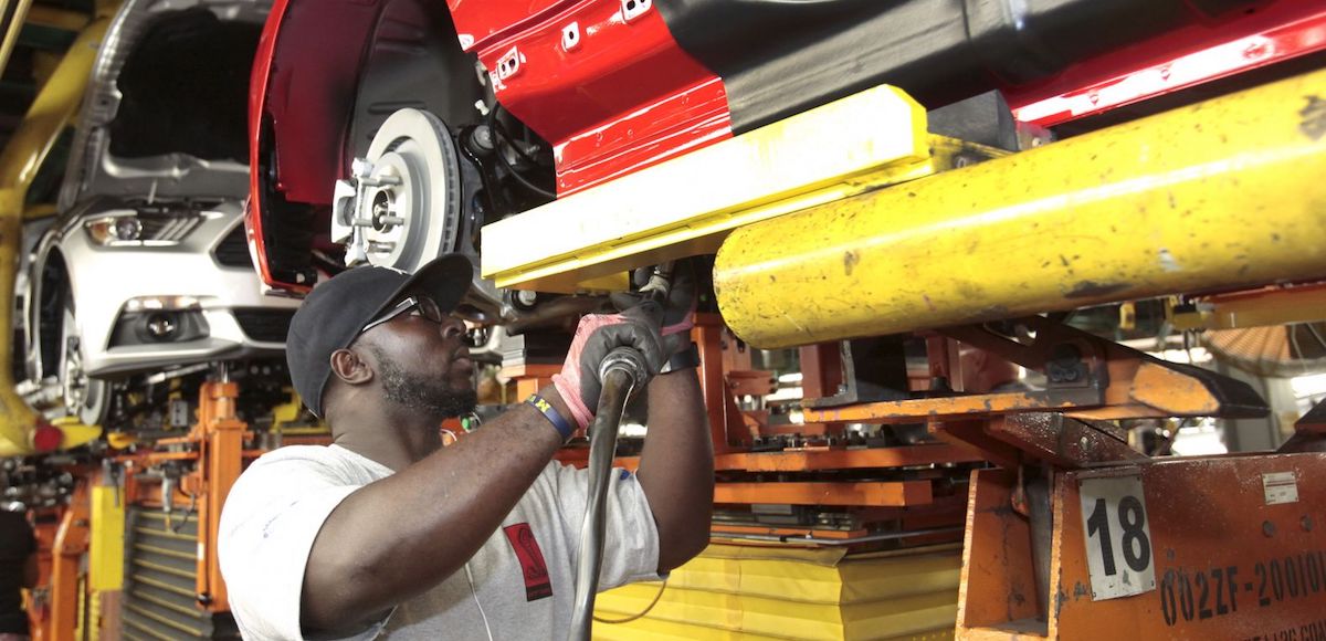 An assembly worker works on 2015 Ford Mustang vehicles on the production line at the Ford Motor Flat Rock Assembly Plant in Flat Rock, Michigan, August 20, 2015. (Photo: Reuters)