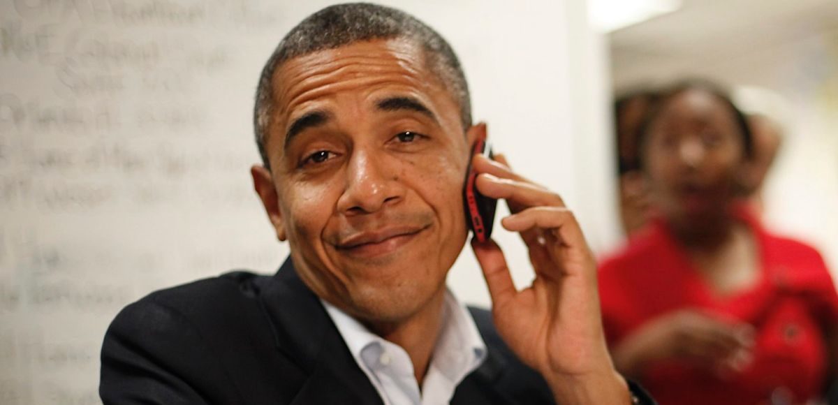 President Barack Obama reacts after realizing he dialed the wrong number while making calls from a local campaign field office during a unscheduled visit, Sunday, Oct. 28, 2012 in Orlando, Fla. (Photo: AP)