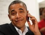 President Barack Obama reacts after realizing he dialed the wrong number while making calls from a local campaign field office during a unscheduled visit, Sunday, Oct. 28, 2012 in Orlando, Fla. (Photo: AP)