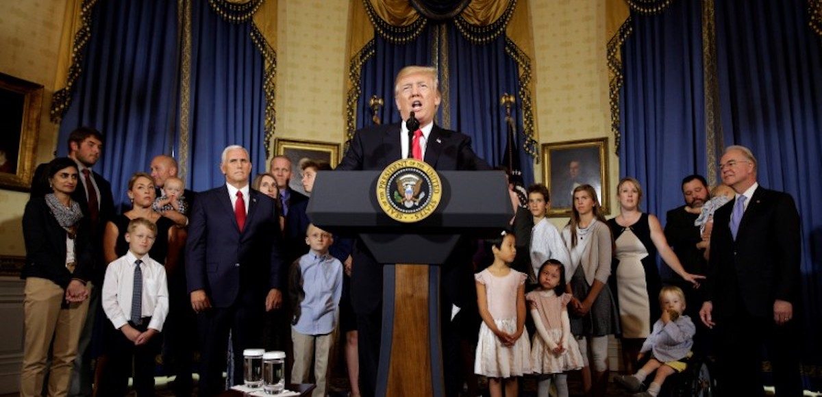 U.S. President Donald Trump calls on Republican Senators to move forward and vote on a healthcare bill to replace the Affordable Care Act, as people negatively affected by the law stand behind him, in the Blue Room of the White House in Washington, U.S., July 24, 2017. (Photo: Reuters)