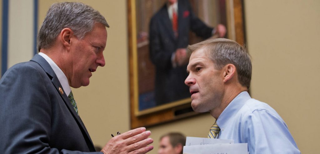 Reps. Mark Meadows, R-N.C., left, and Jim Jordan, R-Ohio, members of the House Freedom Caucus, talk before a House Oversight and Government Reform Committee hearing. (Photo: AP)