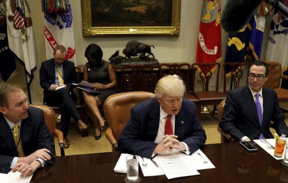 Director of the Office of Management and Budget Mick Mulvaney (L) and Treasury Secretary Steve Mnuchin (R) flank U.S. President Donald Trump as he hosts a 