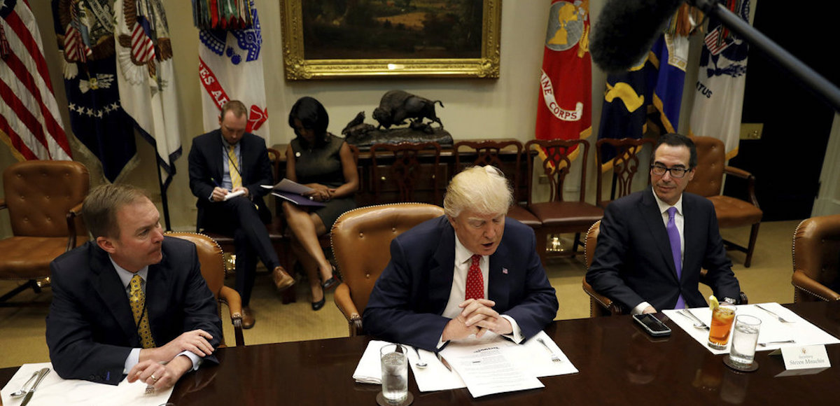 Director of the Office of Management and Budget Mick Mulvaney (L) and Treasury Secretary Steve Mnuchin (R) flank U.S. President Donald Trump as he hosts a "strategic initiatives" lunch at the White House in Washington, U.S., February 22, 2017. (Photo: Reuters)