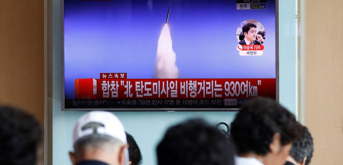 People watch a TV broadcast of a news report on North Korea's ballistic missile test, at a railway station in Seoul, South Korea, July 4, 2017. (Photo: Reuters)