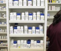 A pharmacy employee looks for medication as she works to fill a prescription while working at a pharmacy in New York December 23, 2009. (Photo: Reuters)