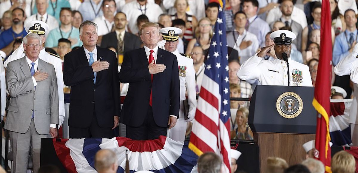 President Donald J. Trump stands for the colors as he arrives during the commissioning ceremony of the aircraft carrier USS Gerald R. Ford (CVN 78) at Naval Station Norfolk, Va., Saturday, July, 22, 2017. (Photo: AP)