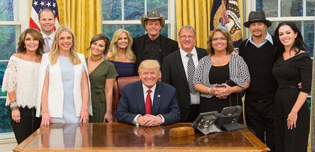 Former Alaska Gov. Sarah Palin, left, rocker Ted Nugent, center back, President Donald Trump, from and center, and Kid Rock, right.