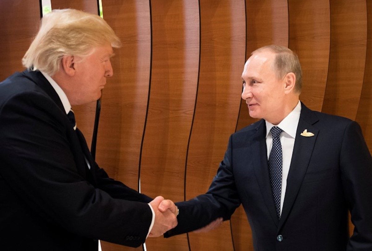 U.S. President Donald Trump and Russian President Vladimir Putin shake hands during the G20 Summit in Hamburg, Germany in this still image taken from video, July 7, 2017. (Courtesy of Handout)