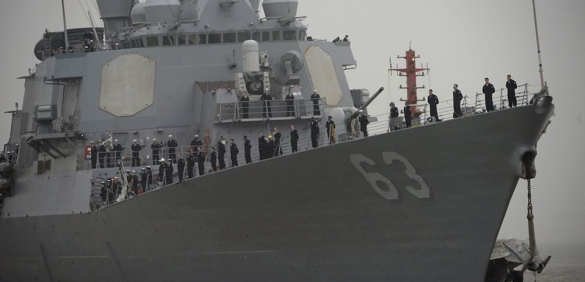 US navy sailors stand in formation on the deck as USS Stethem (DDG 63) destroyer vessel arrives at a military port for an official visit, in Shanghai, China. (Photo: Reuters)