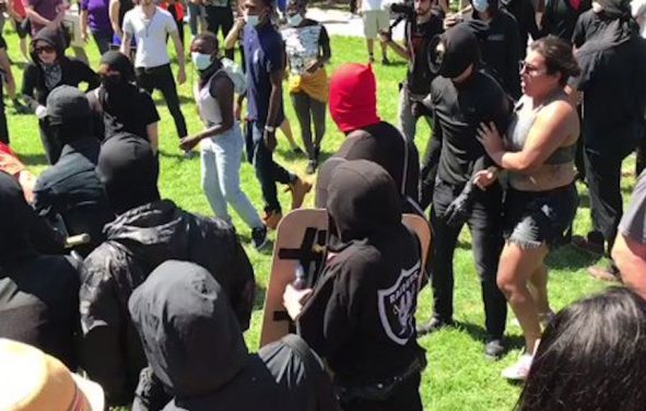 Antifa, otherwise known as so-called anti-fascists, attack journalists outside Martin Luther King Jr. Civic Center Park in Berkeley, California, on Sunday, August 27th, 2017.
