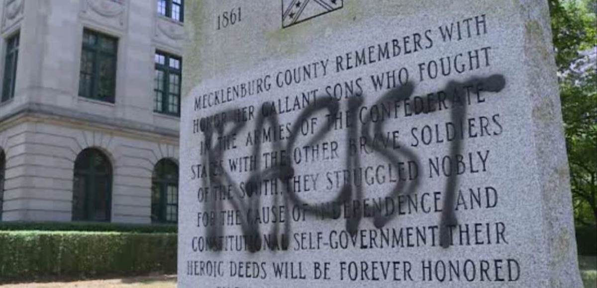A confederate monument in North Carolina vandalized with spray paint and cement. (Photo: AP)