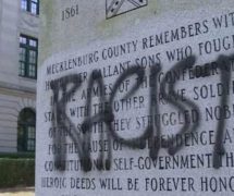 A confederate monument in North Carolina vandalized with spray paint and cement. (Photo: AP)