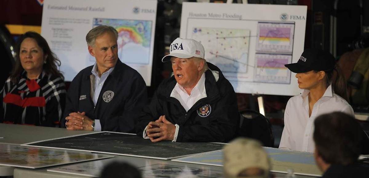 President Donald Trump, center, and First Lady Melania Trump, right, traveled to Corpus Christi, Texas, for a briefing with Gov. Greg Abbott, left, on the efforts to rescue victims of Hurricane Harvey on August 29, 2017. (Photo: AP)