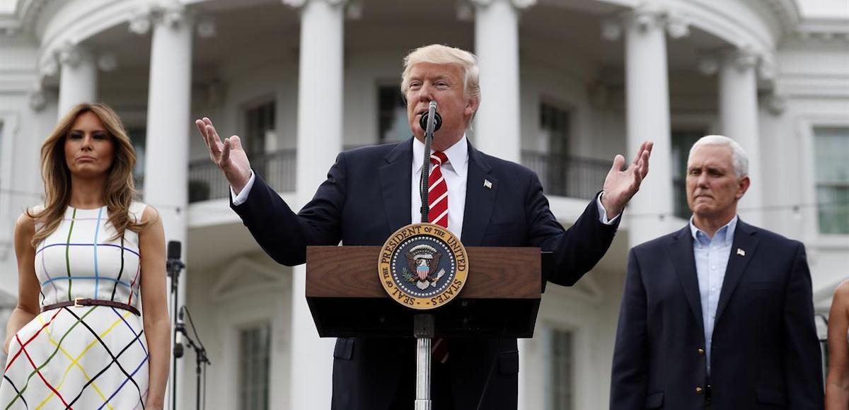 President Donald Trump, center, speaks as first lady Melania Trump and Vice President Mike Pence listen at the Congressional Picnic on the South Lawn of the White House, Thursday, June 22, 2017, in Washington. (Photo: AP)