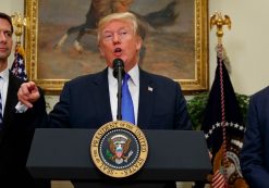President Donald J. Trump, center, announces his support for the RAISE Act, flanked by Sens. Tom Cotton, R-Ark., left, and David Perdue, R-Ga., who first introduced similiar legislation. (Photo: Reuters)