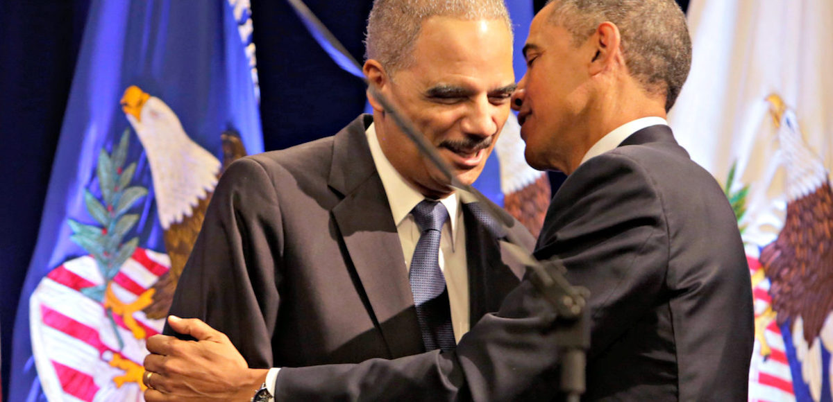 U.S. President Barack Obama greets outgoing U.S. Attorney General Eric Holder at Holder's portrait unveiling ceremony at The Department of Justice in Washington, DC, February 27, 2015. (Photo: AP)