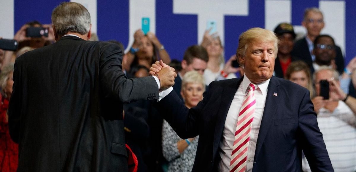 President Donald Trump, right, shakes hands with Senator Luther Strange in Huntsville, Alabama on September 22, 2017. (Photo: AP)