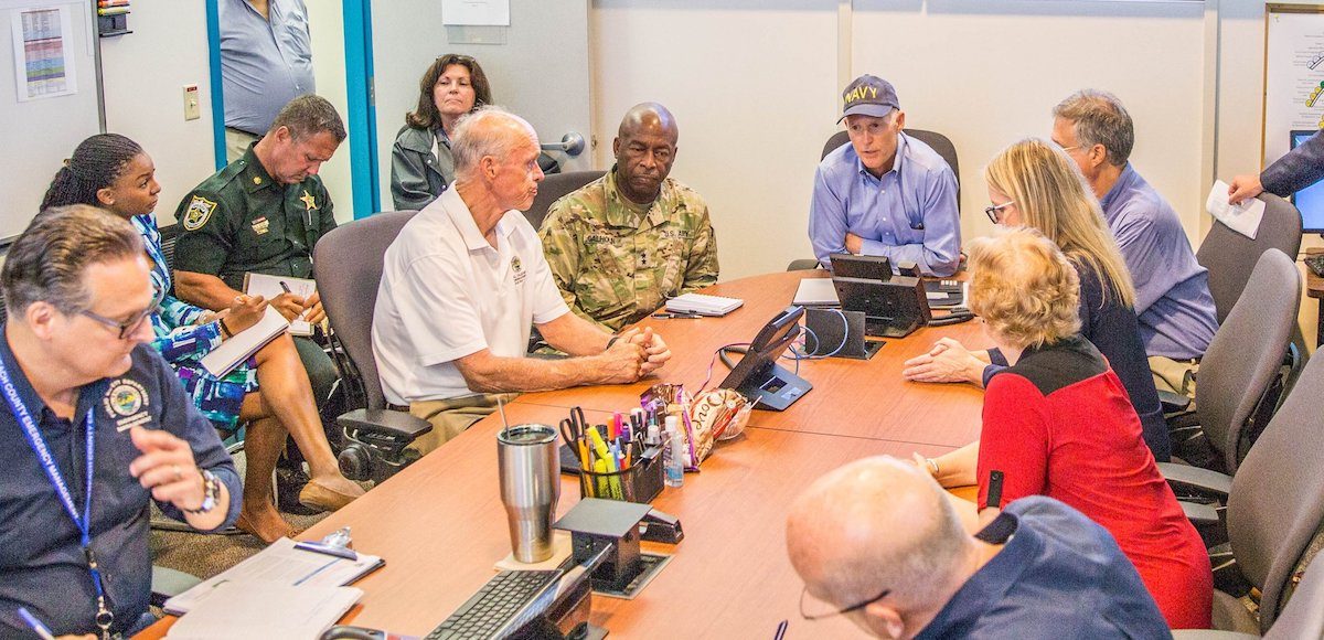 Florida Governor Rick Scott meets with his team and officials in preparation for Hurricane Irma in Jacksonville on September 7, 2017.