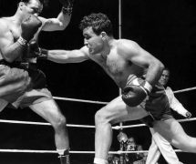 Jake LaMotta, right, finds Algerian Marcel Cerdan wide open and sends a right in third round action of their world middleweight championship title bout in Briggs Stadium, Detroit, Mich., June 16, 1949. LaMotta knocked out Cerdan in the tenth round to become the new world middleweight champion. (AP Photo)