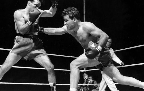 Jake LaMotta, right, finds Algerian Marcel Cerdan wide open and sends a right in third round action of their world middleweight championship title bout in Briggs Stadium, Detroit, Mich., June 16, 1949. LaMotta knocked out Cerdan in the tenth round to become the new world middleweight champion. (AP Photo)