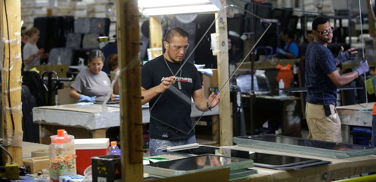 Manufacturing workers at the LCI Industries glass components plant in Elkhart, Indiana. (Photo: AP)