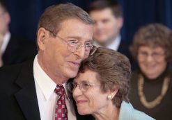 In this Thursday, Oct. 4, 2007, file photo, Sen. Pete Domenici, R-N.M., embraces his wife Nancy, right, as he finishes a news conference, in Albuquerque, N.M. Domenici, who became a power broker in the Senate for his work on the federal budget and energy policy, has died. Domenici was 85. The law firm of Pete Domenici Jr., the senator’s son, confirms that the former lawmaker died Wednesday, Sept. 13, 2017, in Albuquerque but did not provide any details.